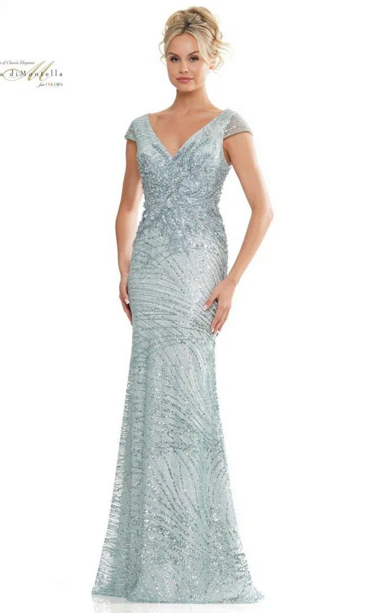 A woman models the Long Formal Dress: Rina Di Montella RD2723 in Seaglass—a light blue, floor-length gown with short sleeves, shimmering intricate beading, and a fitted silhouette—posing against a plain background.
